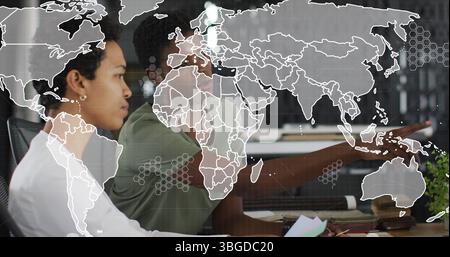 Image of world map over diverse business people in office Stock Photo