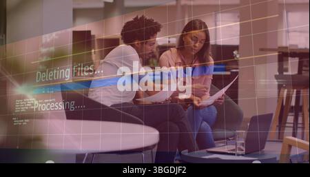 Image of deleting files over diverse female and male coworkers in office Stock Photo
