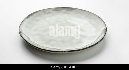 Empty gray textured plate on white background Stock Photo