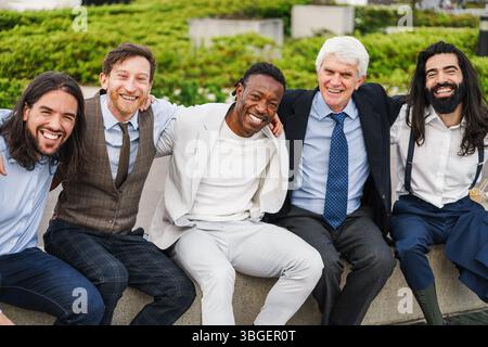 Multiracial business men having fun outside of the office - Businessman lifestyle and entrepreneur concept - Main focus on african male face Stock Photo