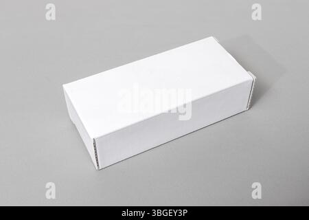 Blank white rectangular cardboard box product packaging template isolated on gray background Stock Photo