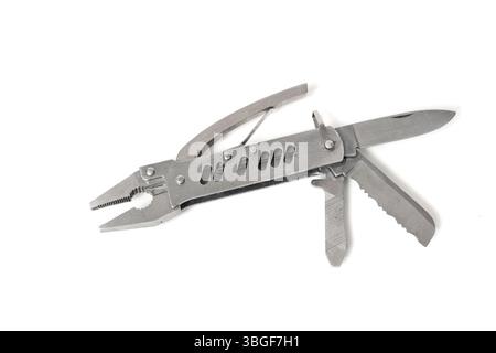 Stainless steel multipurpose tool showing pliers, knife and saw, isolated on white background Stock Photo