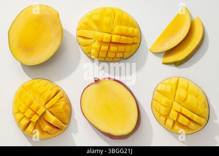 Ripe sliced mango on a white background Stock Photo