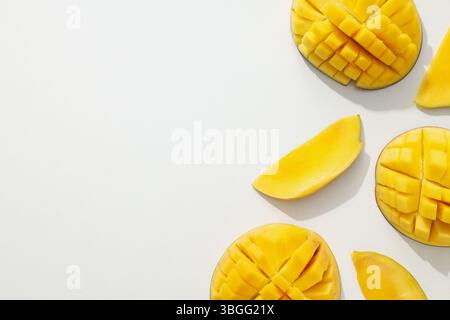 Ripe sliced mango on a white background Stock Photo