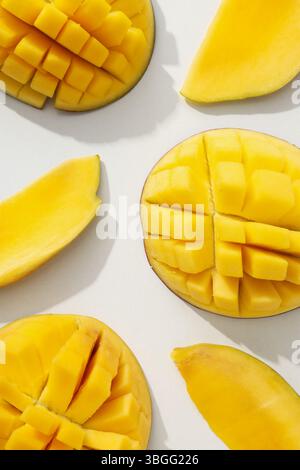 Ripe sliced mango on a white background Stock Photo
