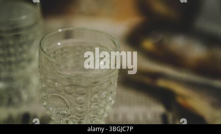 Vodka Glasses on Table with Dried Fish – Traditional Russian Snack Stock Photo