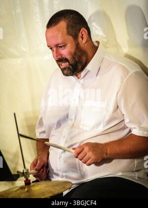 Drummer (name to follow) performing with TriAdd jazz at La Halle concert venue - Boussay, Indre-et-Loire (37), France. Stock Photo