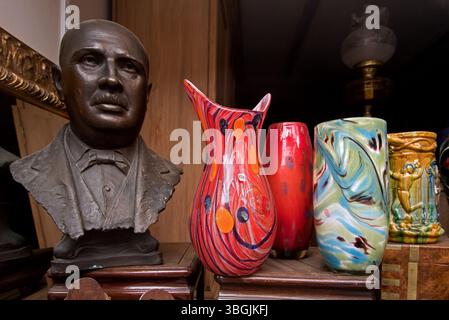 Bust and glass vases displayed in the window of an antique shop in Causewayside, Edinburgh Scotland, UK. Stock Photo