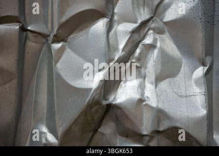 Textured metallic surface creating interesting visual patterns Stock Photo