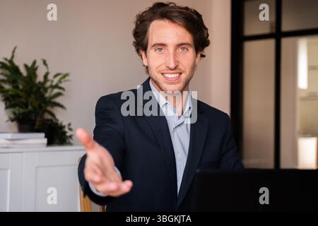 Entrepreneur welcoming a new team member Stock Photo