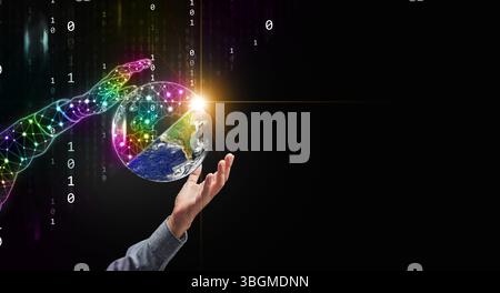 Digital twins concept. Human and digital hands holding a globe devided in halfs of physical and digital worlds for business and technology simulation Stock Photo