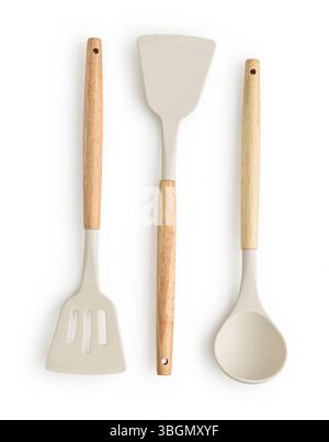 Silicone kitchenware set with wooden handles: white silicone kitchen soup ladle and two white non-stick high-temperature silicone spatula  isolated on Stock Photo