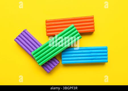 Colorful plasticine on yellow background Stock Photo