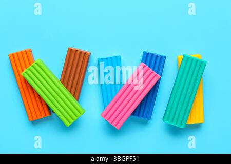 Colorful plasticine on blue background Stock Photo