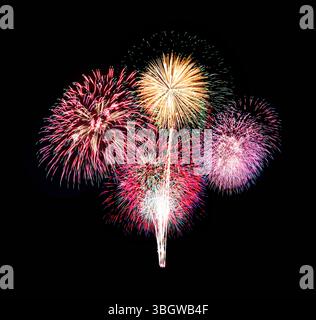 Stunning display of colorful fireworks lighting up the night sky, creating a vibrant atmosphere for celebrations and events. Perfect for festive and n Stock Photo