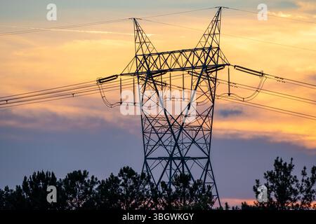 Electric transmission tower in Metro Atlanta, Georgia, at sunset. (USA) Stock Photo
