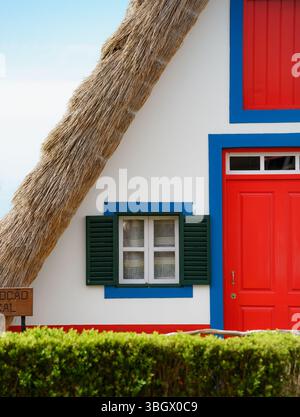 Traditional A-frame Santana houses with vivid colors in Madeira, Portugal Stock Photo
