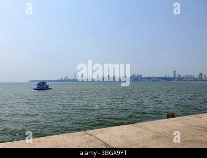 Mumbai, India- April 07, 2025: View of Marine Drive beach in the evening from far away Stock Photo