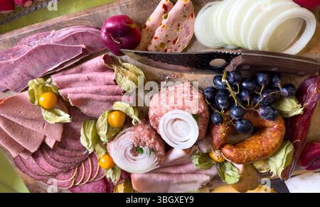 Sausage platter with different types of sausage on a wooden board Stock Photo