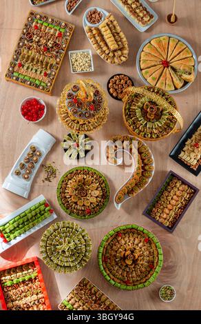 Assorted selection of traditional luxurious Arabic sweets with pistachio, almonds, and cashews. Stock Photo
