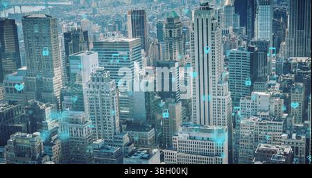 Image of tech icons floating over cityscape Stock Photo