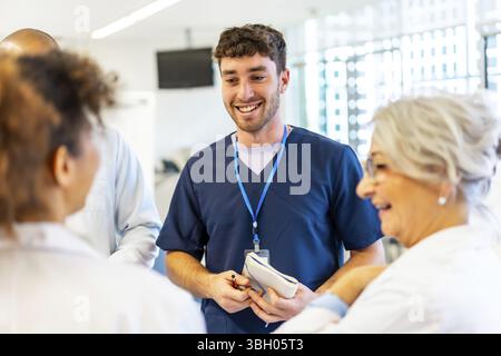 Doctors and nurses collaborating, sharing expertise, and coordinating patient care in a modern hospital setting Stock Photo