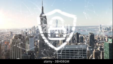 Image of shield padlock and moving digital lines and dots connections over modern cityscape Stock Photo