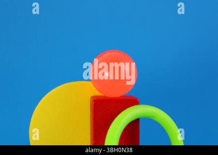 Leader sphere overcoming obstacles, colorful geometric figures Stock Photo