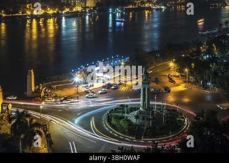 Aerial view of the city of Cairo at night along the river Nile. Skyline ...