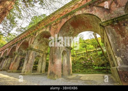 A large brick ancient Aqueduct that passes through the temple grounds. Nanzen-ji, at Zen Buddhist Temple in Higashiyama District, Kyoto, Japan. Spring Stock Photo