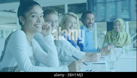 Image of data processing over portrait of diverse male and female colleagues smiling at office Stock Photo