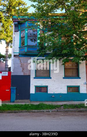 A boarded up old brick apartment along Alexander Street in East Vancouver, BC. Stock Photo