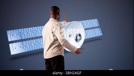 Black Engineer Develops Satellite Model Using 3D CAD Design Software Stock Photo