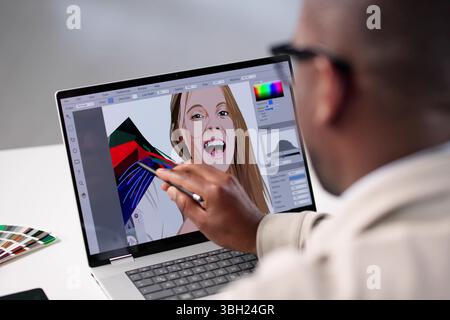 Professional Photographer Edit Graphic Designs On Laptop In Colorful Office Stock Photo