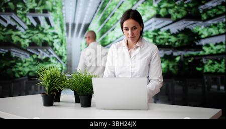 The Sustainable Farmer Using Green Technology To Grow Fresh Vegetables. Stock Photo