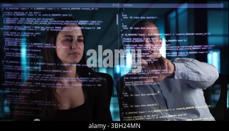 Web Coders Using Online Software On Futuristic Transparent Screen Interfaces. Stock Photo