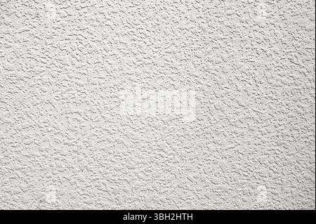 White plaster wall background. Texture of a white wall. Old cement wall painted white Stock Photo