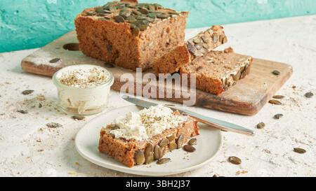 Whole rye bread with pumpkin seeds on top – a rustic, high-fiber artisan loaf, perfect for clean eating, breakfast or healthy lunch plates Stock Photo
