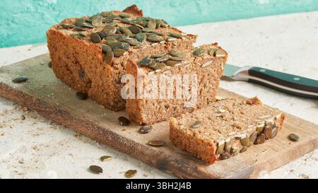 Whole rye bread with pumpkin seeds on top – a rustic, high-fiber artisan loaf, perfect for clean eating, breakfast or healthy lunch plates Stock Photo