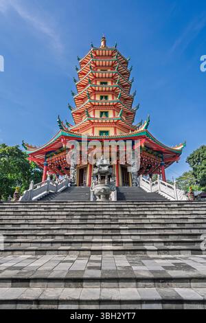 Scenic low angle landscape view of famous Avalokitesvara or Guanyin pagoda and stairs at Vihara Buddhagaya Watugong, Semarang, Central Java, Indonesia Stock Photo