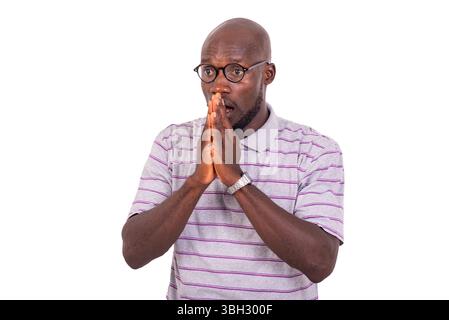 young surprised business man with hands together while looking aside. Stock Photo