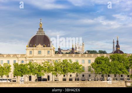 Historic Hotel-Dieu at with the Notre dame in the background in Lyon, France Stock Photo