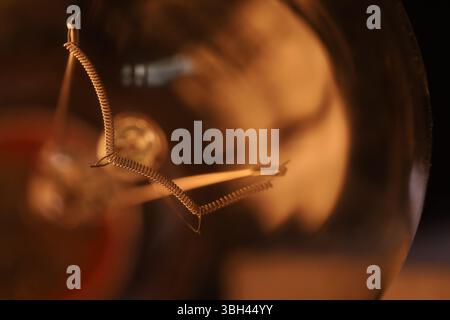 Tungsten filament, an incandescent light bulb, macro view, Metal texture in macro, silver wire Stock Photo