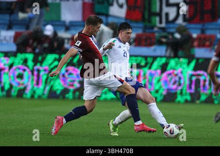 Alessandro Bastoni of Italy and Sorloth Alexander of Norway during the