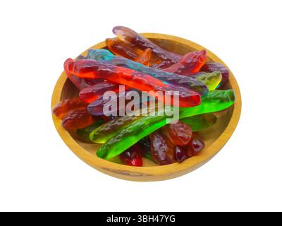 Side view of a small bowl filled with gummi candy snakes on a white background. Stock Photo