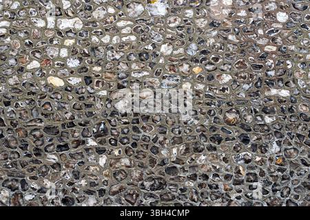 Textured Wall Made of Rough Flint Stones Stock Photo