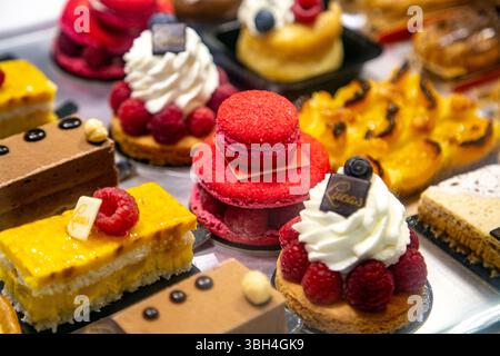 Colourful cakes and macarons at Lucas Patisserie in Bayonne, Basque Country, France Stock Photo
