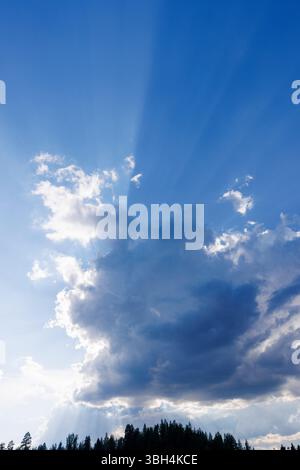 Sun glowing behind a dark cloud, Finland Stock Photo