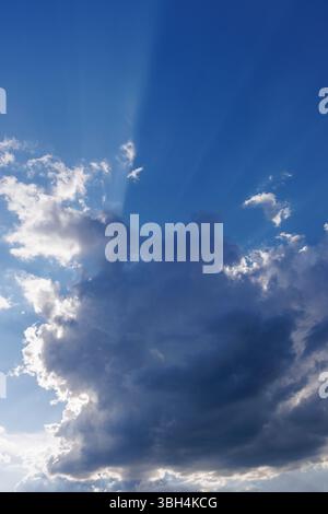 Sun glowing behind a dark cloud, Finland Stock Photo