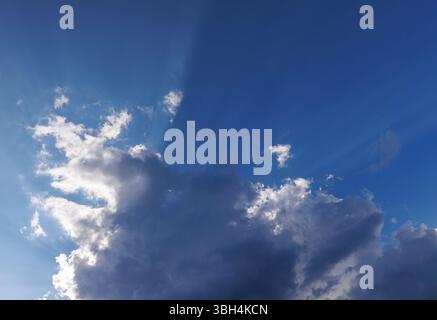 Sun glowing behind a dark cloud, Finland Stock Photo